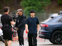 Guanyu Zhou of Stake F1 Team KICK Sauber is arriving into the paddock during Thursday media day of the Spanish GP, the 10th round of the For...