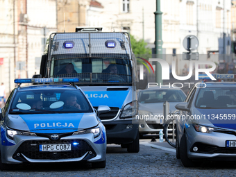 Police are at Wawel Castle during Jaroslaw Kaczynski's monthly arrival at his brother's grave in Krakow, Poland, on June 18, 2023. Every 18t...