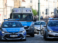 Police are at Wawel Castle during Jaroslaw Kaczynski's monthly arrival at his brother's grave in Krakow, Poland, on June 18, 2023. Every 18t...