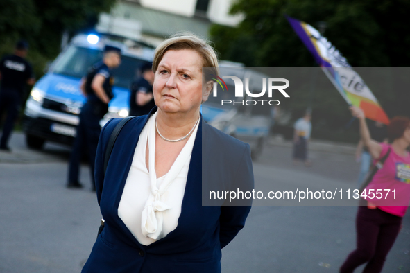 Anna Fotyga, a member of the European Parliament, is walking past the activists during a protest against Jaroslaw Kaczynski's monthly arriva...