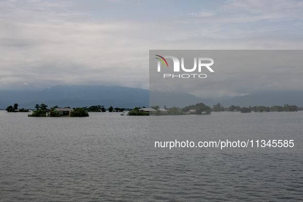 Houses are being seen partially submerged in Companiganj, Sylhet, Bangladesh, on June 20, 2024. In Sylhet, lashing rain and rivers swollen b...