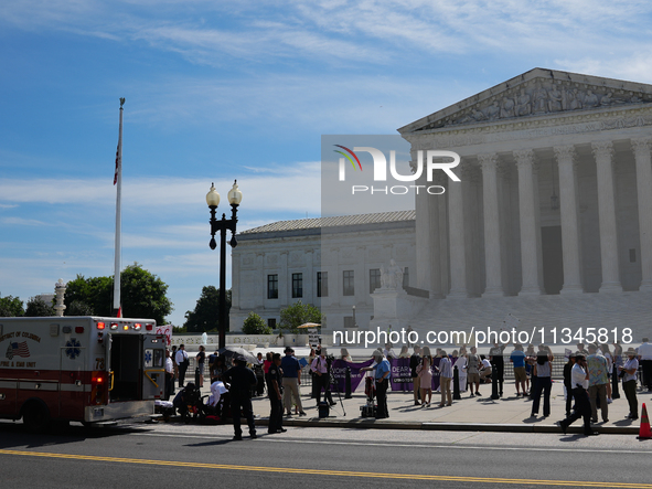 An elderly man is fainting in front of the Supreme Court today as temperatures in Washington, DC, are reaching into the 90s. The court is is...