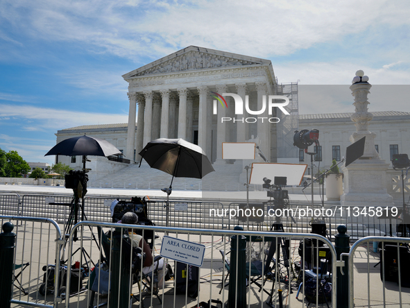 Media crews are waiting in the heat wave in Washington, D.C., as the Supreme Court is preparing to release the final decisions of its term. 