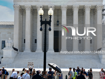 An elderly man is fainting in front of the Supreme Court today as temperatures in Washington, DC, are reaching into the 90s. The court is is...