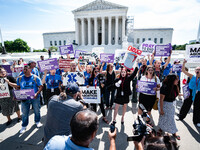 About a dozen pro-life activists are gathering outside the US Supreme Court in Washington, DC, on June 20, 2024, as they await a decision in...