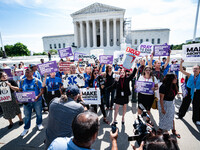 About a dozen pro-life activists are gathering outside the US Supreme Court in Washington, DC, on June 20, 2024, as they await a decision in...