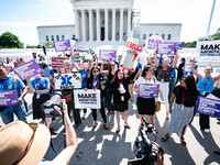 About a dozen pro-life activists are gathering outside the US Supreme Court in Washington, DC, on June 20, 2024, as they await a decision in...