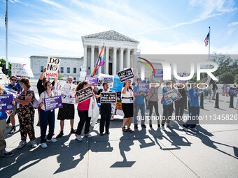 About a dozen pro-life activists are gathering outside the US Supreme Court in Washington, DC, on June 20, 2024, as they await a decision in...