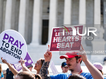 About a dozen pro-life activists are gathering outside the US Supreme Court in Washington, DC, on June 20, 2024, as they await a decision in...