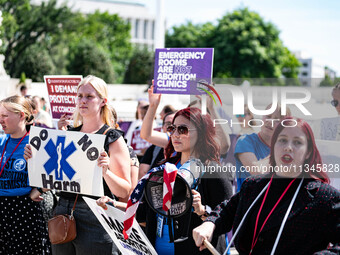 About a dozen pro-life activists are gathering outside the US Supreme Court in Washington, DC, on June 20, 2024, as they await a decision in...