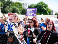 About a dozen pro-life activists are gathering outside the US Supreme Court in Washington, DC, on June 20, 2024, as they await a decision in...