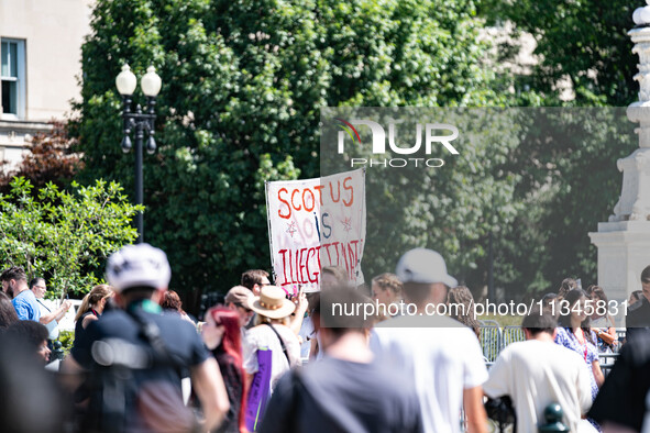 About a dozen pro-life activists are gathering outside the US Supreme Court in Washington, DC, on June 20, 2024, as they await a decision in...