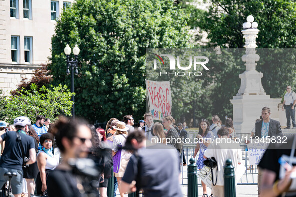 About a dozen pro-life activists are gathering outside the US Supreme Court in Washington, DC, on June 20, 2024, as they await a decision in...