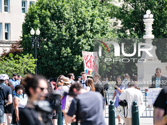 About a dozen pro-life activists are gathering outside the US Supreme Court in Washington, DC, on June 20, 2024, as they await a decision in...