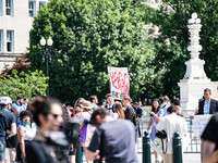 About a dozen pro-life activists are gathering outside the US Supreme Court in Washington, DC, on June 20, 2024, as they await a decision in...