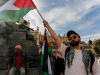 Palestinians and their supporters hold a protest on an International Refugee Day in support of Palestine and against Israeli war actions in...