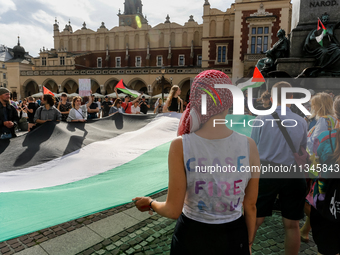 Palestinians and their supporters hold a protest on an International Refugee Day in support of Palestine and against Israeli war actions in...