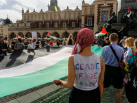 Palestinians and their supporters hold a protest on an International Refugee Day in support of Palestine and against Israeli war actions in...