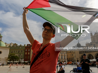 Palestinians and their supporters hold a protest on an International Refugee Day in support of Palestine and against Israeli war actions in...