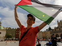 Palestinians and their supporters hold a protest on an International Refugee Day in support of Palestine and against Israeli war actions in...