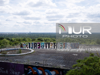 Tourists and locals are visiting Teufelsberg in Berlin, Germany, on June 20, 2024. The Teufelsberg is a rubble hill in the west of Berlin an...