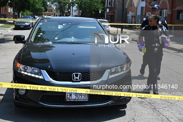 A vehicle is being found at the crime scene riddled with bullet holes and bullet damage. Two male victims are in critical condition after be...