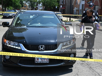 A vehicle is being found at the crime scene riddled with bullet holes and bullet damage. Two male victims are in critical condition after be...