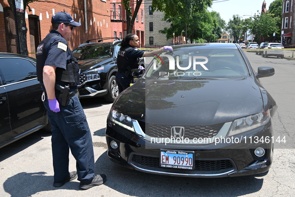 A vehicle is being found at the crime scene riddled with bullet holes and bullet damage. Two male victims are in critical condition after be...