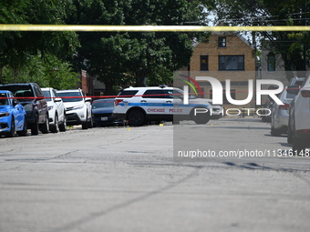 Shell casings are being located at the crime scene. Two male victims are in critical condition after being shot in broad daylight in Chicago...