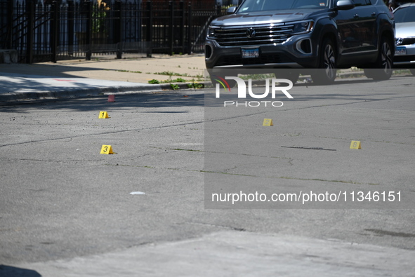 Shell casings are being located at the crime scene. Two male victims are in critical condition after being shot in broad daylight in Chicago...