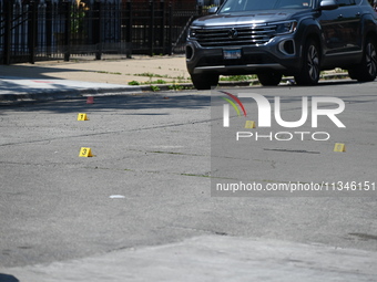 Shell casings are being located at the crime scene. Two male victims are in critical condition after being shot in broad daylight in Chicago...