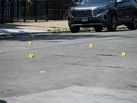 Shell casings are being located at the crime scene. Two male victims are in critical condition after being shot in broad daylight in Chicago...