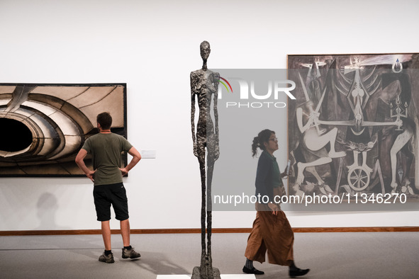 People are visiting the New National Gallery Of Berlin, Neue Nationalgalerie in Berlin, Germany, on June 20, 2024. 