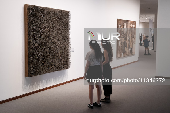 People are visiting the New National Gallery Of Berlin, Neue Nationalgalerie in Berlin, Germany, on June 20, 2024. 