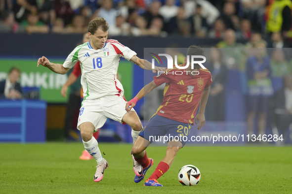 Pedri central midfield of Spain and FC Barcelona and Nicolo Barella central midfield of Italy and Inter Milan compete for the ball during th...