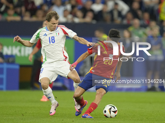 Pedri central midfield of Spain and FC Barcelona and Nicolo Barella central midfield of Italy and Inter Milan compete for the ball during th...