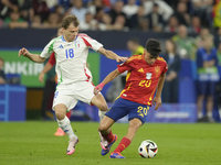 Pedri central midfield of Spain and FC Barcelona and Nicolo Barella central midfield of Italy and Inter Milan compete for the ball during th...