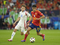 Pedri central midfield of Spain and FC Barcelona and Nicolo Barella central midfield of Italy and Inter Milan compete for the ball during th...