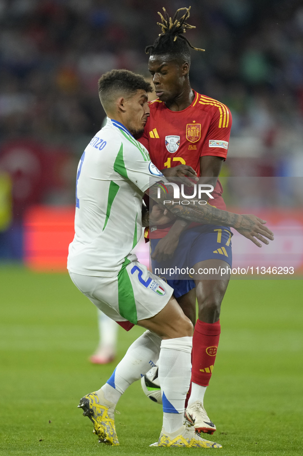 Giovanni Di Lorenzo right-back of Italy and SSC Napoli and Nico Williams left winger of Spain and Athletic Club Bilbao compete for the ball...