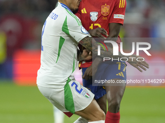 Giovanni Di Lorenzo right-back of Italy and SSC Napoli and Nico Williams left winger of Spain and Athletic Club Bilbao compete for the ball...