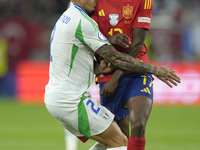 Giovanni Di Lorenzo right-back of Italy and SSC Napoli and Nico Williams left winger of Spain and Athletic Club Bilbao compete for the ball...