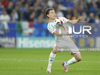 Nicolo Barella central midfield of Italy and Inter Milan controls the ball during the UEFA EURO 2024 group stage match between Spain and Ita...