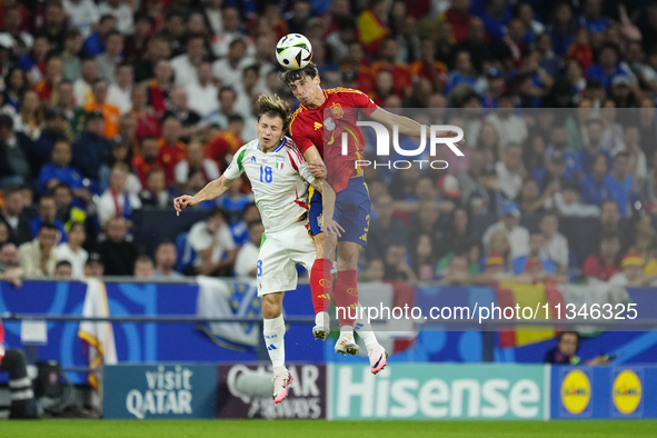 Nicolo Barella central midfield of Italy and Inter Milan and Robin Le Normand centre-back of Spain and Real Sociedad compete for the ball du...