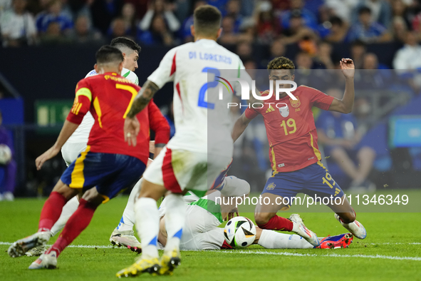 Lamine Yamal right winger of Spain and FC Barcelona  in action during the UEFA EURO 2024 group stage match between Spain and Italy at Arena...