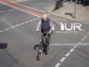 A man is cycling in Berlin, Germany, on June 20, 2024. (