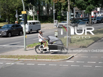 A woman is cycling in Berlin, Germany, on June 20, 2024. (