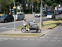 A woman is cycling in Berlin, Germany, on June 20, 2024. (