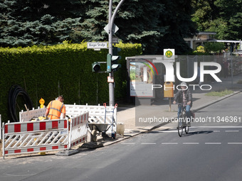 A man is cycling in Berlin, Germany, on June 20, 2024. (