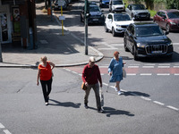 People are walking in Berlin, Germany, on June 20, 2024. (