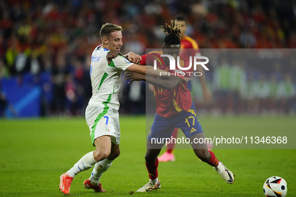 Davide Frattesi central midfield of Italy and Inter Milan and Nico Williams left winger of Spain and Athletic Club Bilbao compete for the ba...